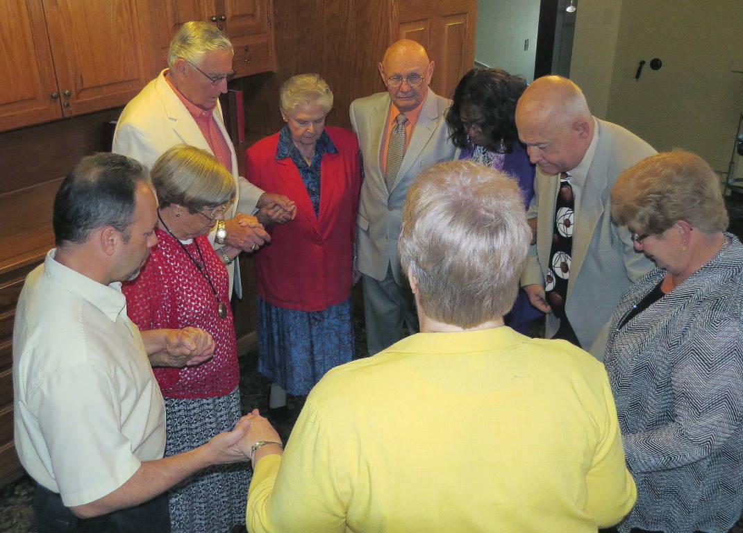 Eucharistic Ministers pray before serving at their Mass.