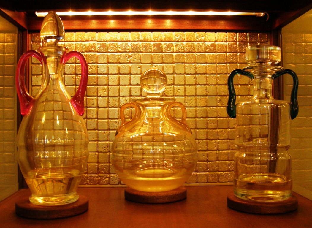3 bottles of Sacred Chrism in an ambry